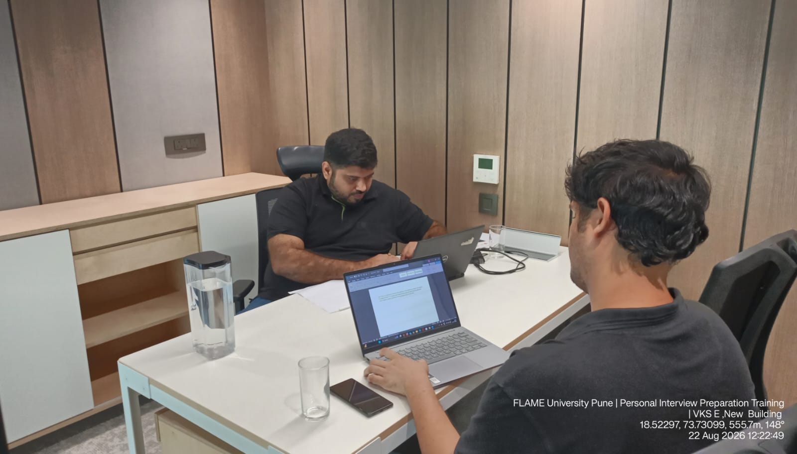 Trainer working through interview technique with a student